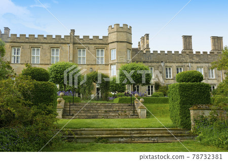 Corby, U.K., 6 May 2021. Dene Park Castle. Old big medieval traditional english castle building with green gardens panorama Corby, U.K., 6 May 2021. Dene Park Castle. Old big medieval traditional english castle building with green gardens panorama 78732381