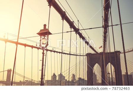 Retro stylized picture of Brooklyn Bridge at sunrise, New York City, USA Retro stylized picture of Brooklyn Bridge at sunrise, New York City, USA 78732463