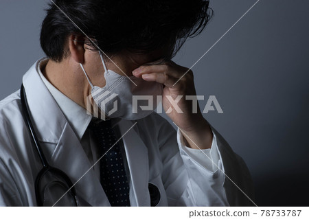 Tired doctor Tired doctor 78733787