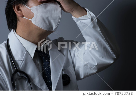 Tired doctor Tired doctor 78733788