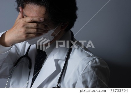 Tired doctor Tired doctor 78733794