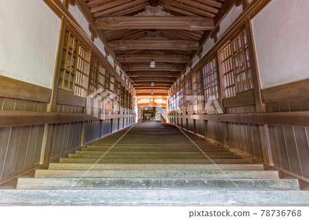 Steep wooden staircase and windows, Eiheiji, Japan. 78736768