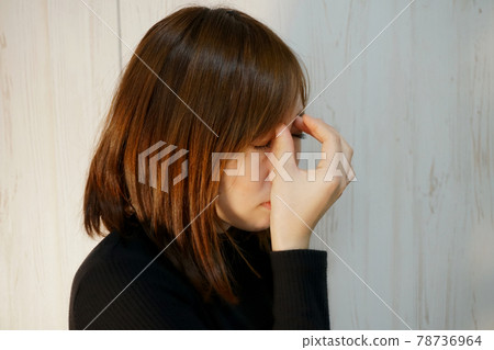Image of a woman suffering from eye strain 78736964