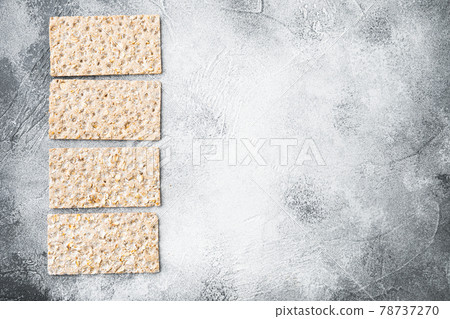 Buckwheat crisp bread, on gray stone table background, top view flat lay, with copy space for text Buckwheat crisp bread, on gray stone table background, top view flat lay, with copy space for text 78737270