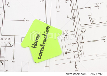 House shape made of paper with inscription home construction and electrical housing plan House shape made of paper with inscription home construction and electrical housing plan 78737979