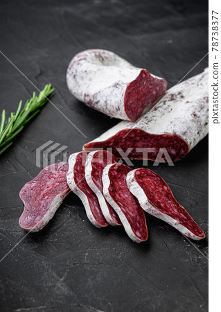 Longaniza, traditional salami spanish sausage on black textured surface 78738377