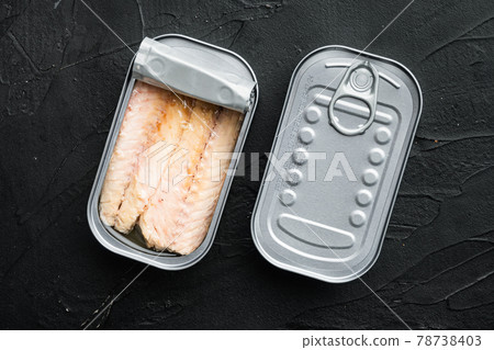 Canned Mackerel fillet, fish preserves, in tin can, on black background, top view flat lay 78738403