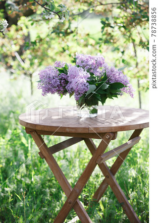 bouquet of lilacs on the table in the summer garden bouquet of lilacs on the table in the summer garden 78738856