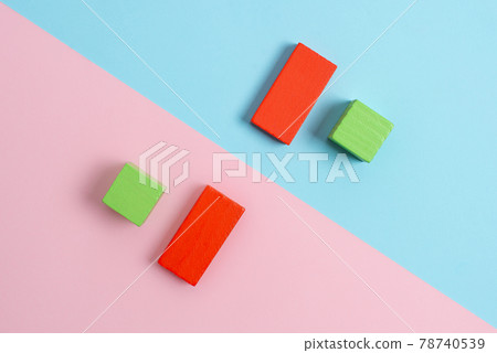 Comparison of Two Objects Blocks Pencils Sticker Notes Facing Inward Outward Making An Arrangement Reflection On a Separated Coloured Background Shot In A Flat Lay Perspective Comparison of Two Objects Blocks Pencils Sticker Notes Facing Inward Outward Making An Arrangement Reflection On a Separated Coloured Background Shot In A Flat Lay Perspective 78740539