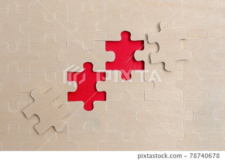 Close-Up White Jigsaw Pattern Puzzle Pieces To Be Connected With Missing Last Piece Positioned On A Flat Lay Background With Different Texture And Paper Supplies Accesories Close-Up White Jigsaw Pattern Puzzle Pieces To Be Connected With Missing Last Piece Positioned On A Flat Lay Background With Different Texture And Paper Supplies Accesories 78740678