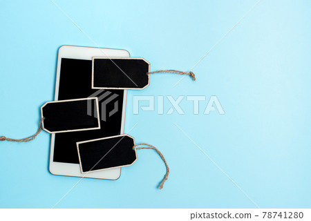 Collection of Real Blank Empty Sticker Card Tag With An Elastic Band On A Different Color Background Containing Modern Gadget Checklist For Labeling Informative Content Purposes 78741280