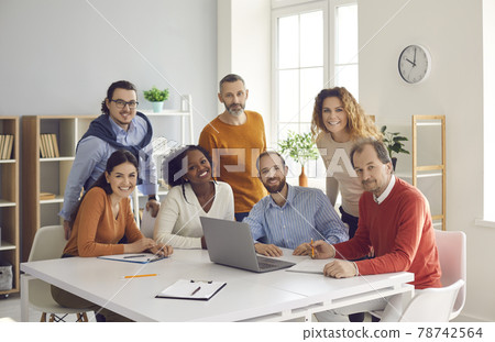 Happy diverse group of people working in office together portrait Happy diverse group of people working in office together portrait 78742564