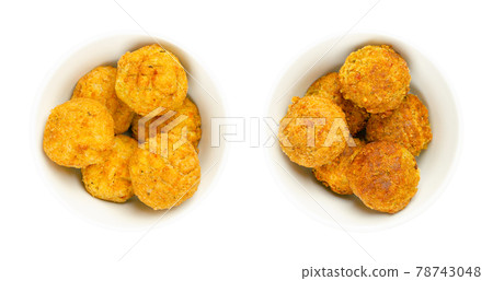Vegan falafel balls, pre-fried and deep-fried in white bowls. Groups of ball shaped fritters, based on chickpeas, a traditional Middle Eastern food. Convenience food. Close-up, from above, food photo. Vegan falafel balls, pre-fried and deep-fried in white bowls. Groups of ball shaped fritters, based on chickpeas, a traditional Middle Eastern food. Convenience food. Close-up, from above, food photo. 78743048