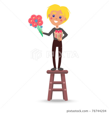 Small Boy Standing on Chair with Gift and Flowers 78744204