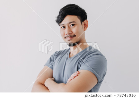 Confident and happy man in blue t-shirt isolated on white background. Confident and happy man in blue t-shirt isolated on white background. 78745010