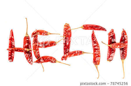 The word Health is laid out from pungent dry pepper pods on a white background. The word Health is laid out from pungent dry pepper pods on a white background. 78745256