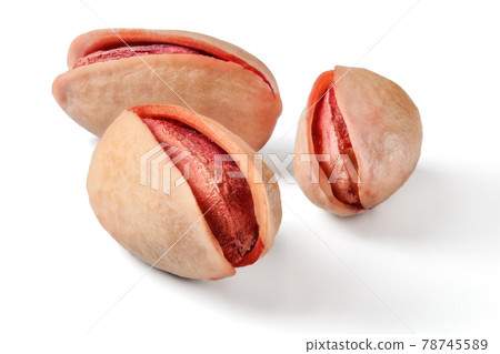 Three roasted, salted, red turkish pistachios isolated on white background. Three roasted, salted, red turkish pistachios isolated on white background. 78745589