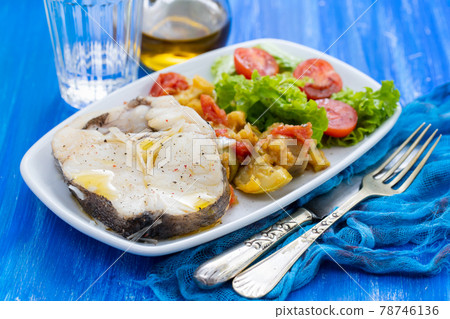 boiled fish with salad on white dish boiled fish with salad on white dish 78746136
