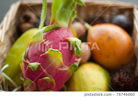 Big basket of fresh tropical fruits, passion fruit, carambola, dragon fruit or pitaya, mangosteen, lichi, granadilla. Exotic fruits, healthy eating concept 78746860