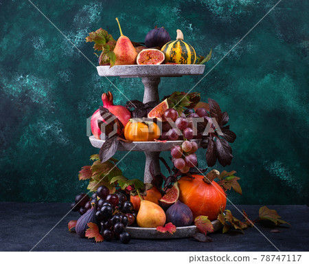 Halloween composition with autumn fruits 78747117