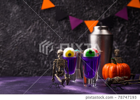 Halloween purple cocktail with eyes. 78747193