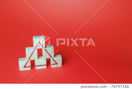Wooden blocks make a triangle. Society or business ranking system concept. Abstraction of solidity. Unity and discipline. Building a team, teamwork cooperation. Systemic organization. Wooden blocks make a triangle. Society or business ranking system concept. Abstraction of solidity. Unity and discipline. Building a team, teamwork cooperation. Systemic organization. 78747388