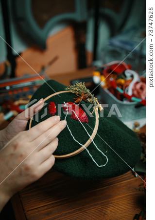 Embroidery process with cotton thread of mushrooms hat. Embroidery process with cotton thread of mushrooms hat. 78747628