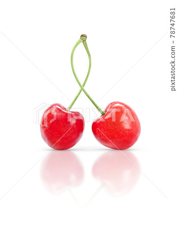 Pair of sweet cherries isolated on white background with shadow and reflection. 78747681