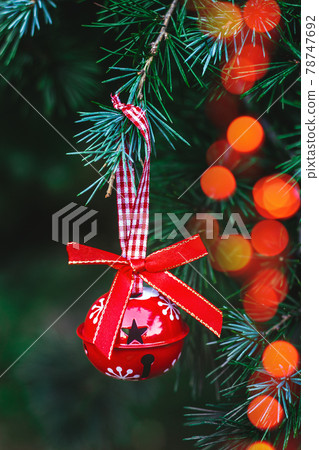 Christmas ornaments hanging on a Christmas tree; holidays background Christmas ornaments hanging on a Christmas tree; holidays background 78747692