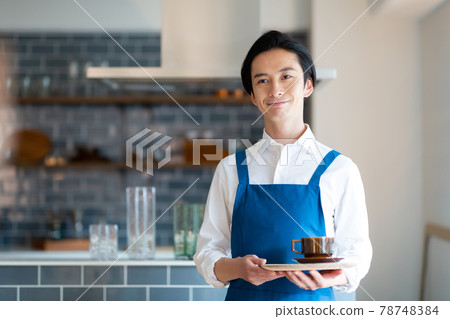 A man taking an order at a cafe 78748384
