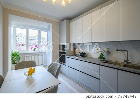 Modern gray and white kitchen interior Modern gray and white kitchen interior 78748442