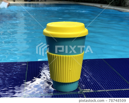 reusable bamboo mug at the swimming pool 78748509