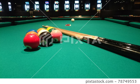 Billiard table and cue with nine-ball under the spotlight Billiard table and cue with nine-ball under the spotlight 78749553