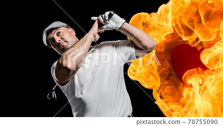 Caucasian senior male golf player swinging club against fire flame effect on black background 78755090