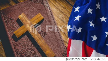 American flag over wooden cross over bible against wooden background 78756138