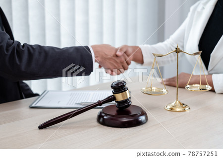 shake hand Professional male lawyers work at a law office There are scales, Scales of justice, judges gavel, and litigation documents. Concepts of law and justice shake hand Professional male lawyers work at a law office There are scales, Scales of justice, judges gavel, and litigation documents. Concepts of law and justice 78757251