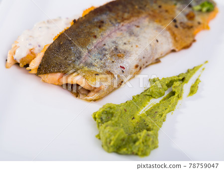 Tasty fried river trout fillet with sause tartar on plate 78759047