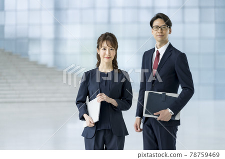 Business person male and female portrait 78759469