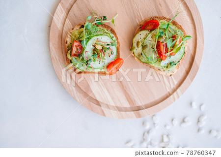 Tasty italian bruschetta on the wooden plate 78760347