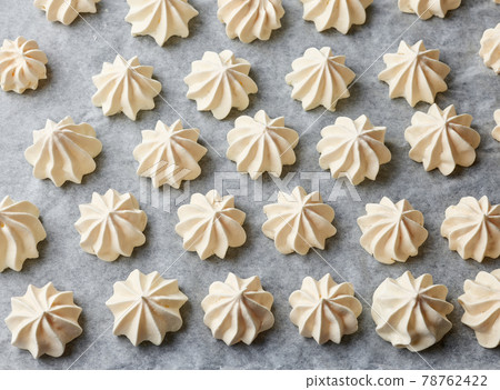 freshly baked meringue cookies 78762422