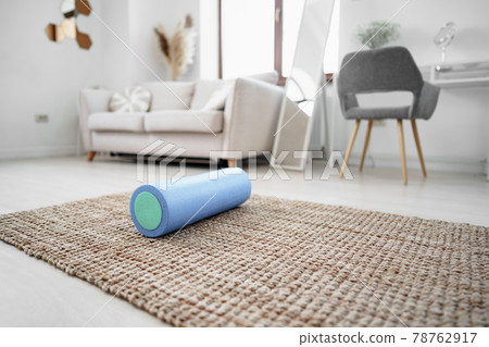 Sport massage roll on a mat indoors 78762917
