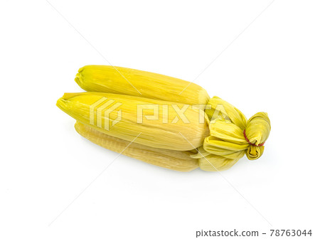 Organic group of fresh corn streamed in shell, the isolated image on white background. 78763044