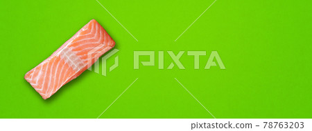 Salmon steak on green background. Horizontal banner Salmon steak on green background. Horizontal banner 78763203