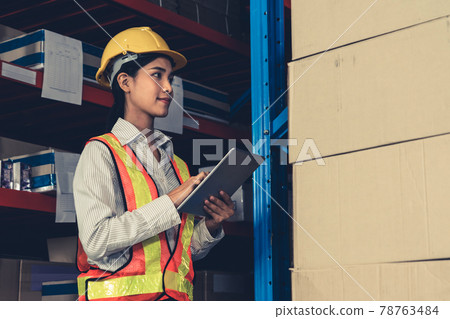 Female warehouse worker working at the storehouse 78763484