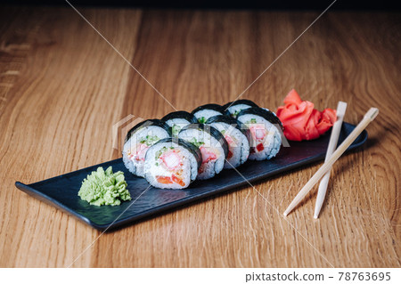 Sushi on a Wooden Table in Restaurant, Delicious Japanese Food, Sushi Rolls 78763695