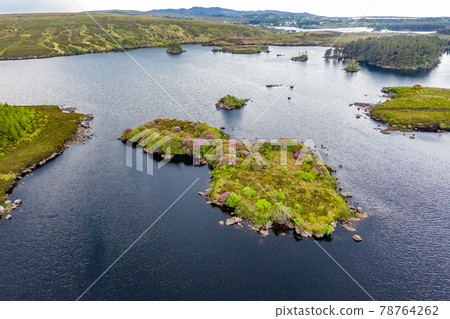 Aerial view of island in Lough Craghy, Tully Lake - Part of the Dungloe systen 78764262