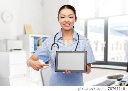 asian female nurse with tablet pc at hospital asian female nurse with tablet pc at hospital 78765646