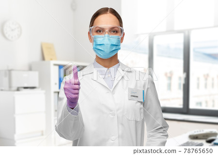 female scientist in medical mask and goggles female scientist in medical mask and goggles 78765650