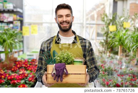 happy gardener or seller with box of garden tools happy gardener or seller with box of garden tools 78765726