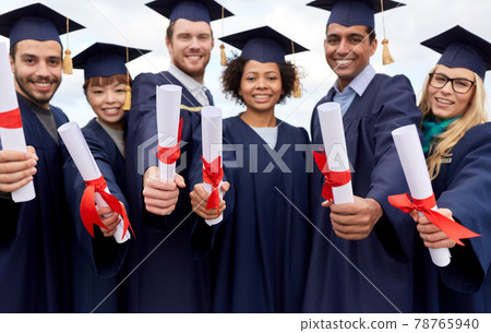 graduate students in mortar boards with diplomas graduate students in mortar boards with diplomas 78765940